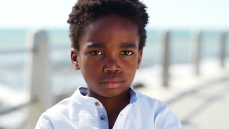 child with an attitude at the beach on a holiday
