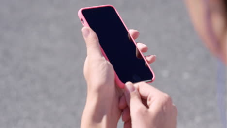 athletic fitness woman getting ready to jog with music from smart phone in city