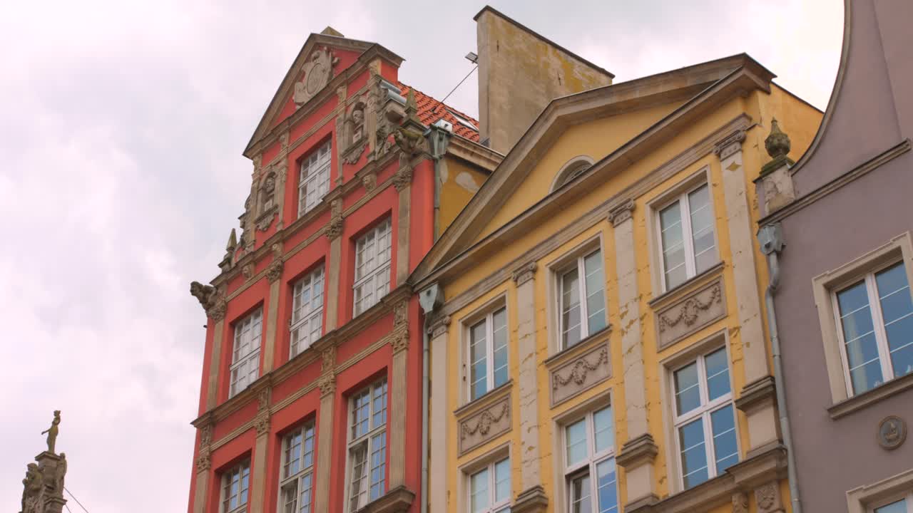 Low angle shot of polish architecture exterior detail of old town in Gdansk, Poland during evening. 4k.