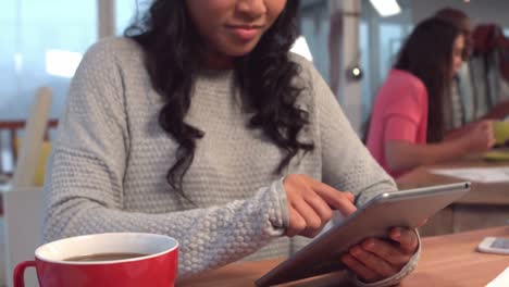 casual businesswoman using her tablet