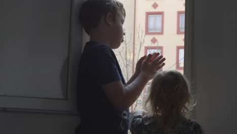 kids in coronavirus quarantine boy giving applause to medical staff