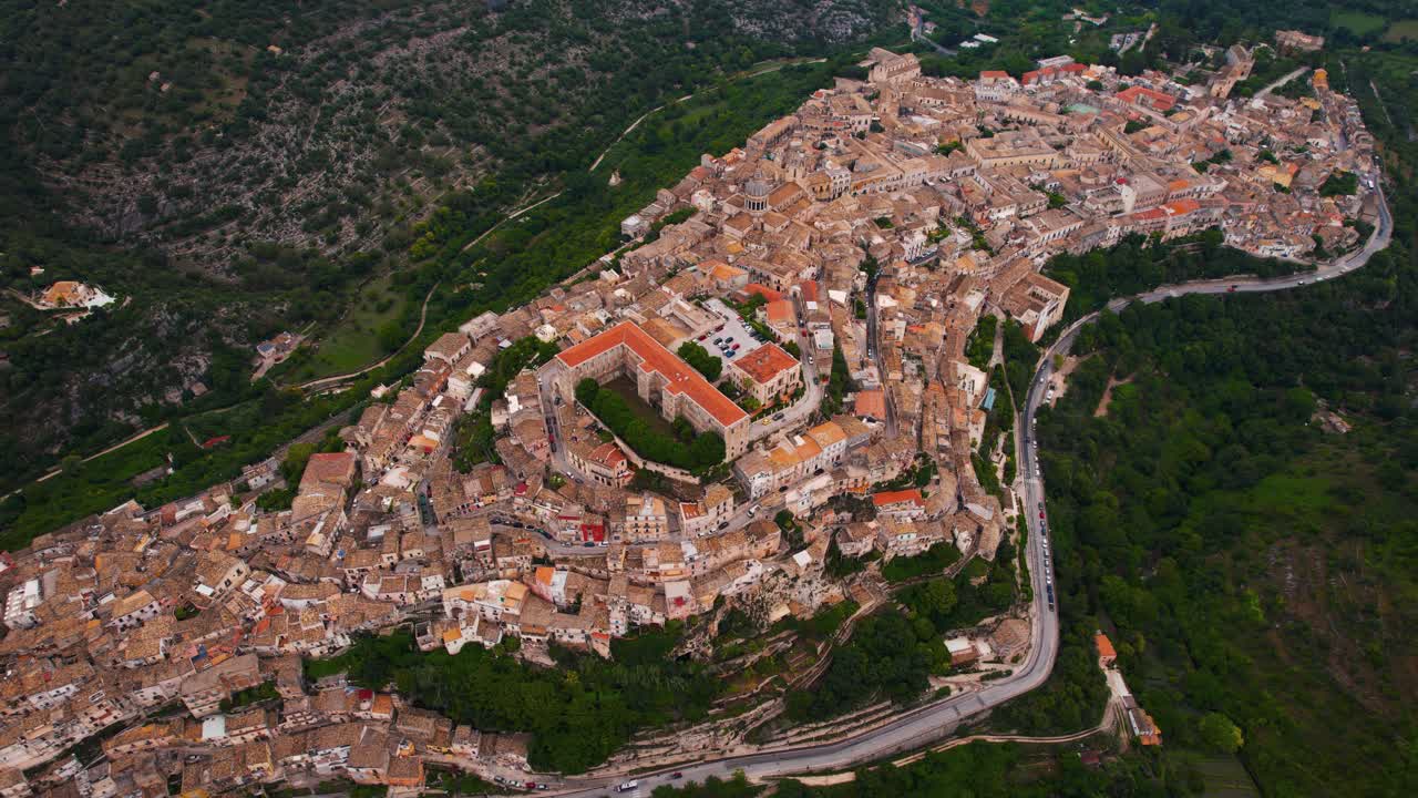 Ragusa Ibla winding alleys, panoramic view over the old town, valley and cathedral. Aerial Sicily.