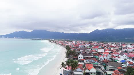 Aerial View Dolly of the Beautiful Coastline and the Mountains in Ninh HòA.