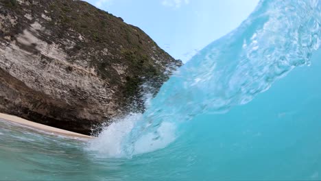 Extreme-Slow-Motion-shot-of-being-inside-the-barrel-of-a-large-wave-at-KelingKing-Beach,-on-the-island-of-Nusa-Penida,-Bali,-Indonesia