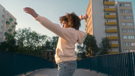 black woman dancing on the bridge.