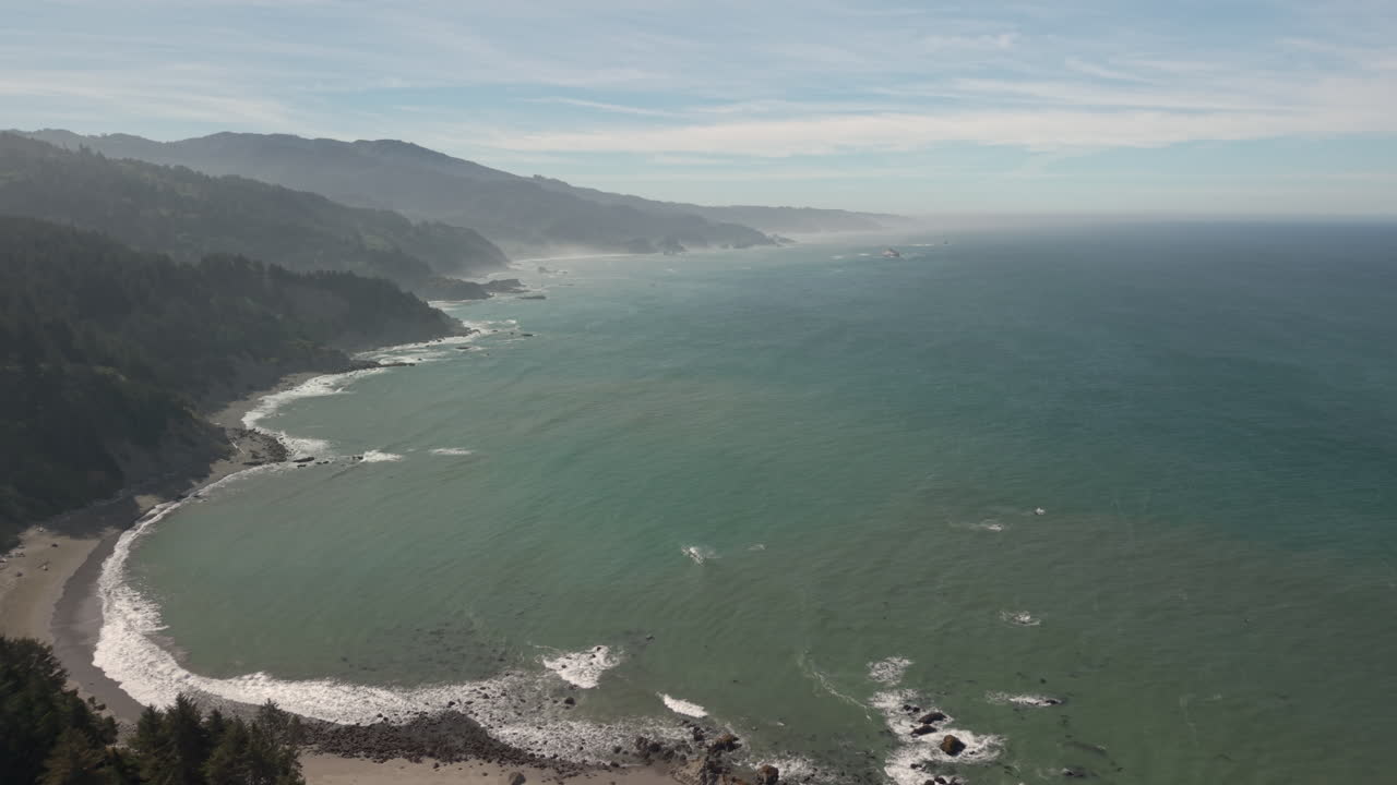Oregon Coast seascape and landscape with beautiful ocean beach nature scenes, drone aerial view
