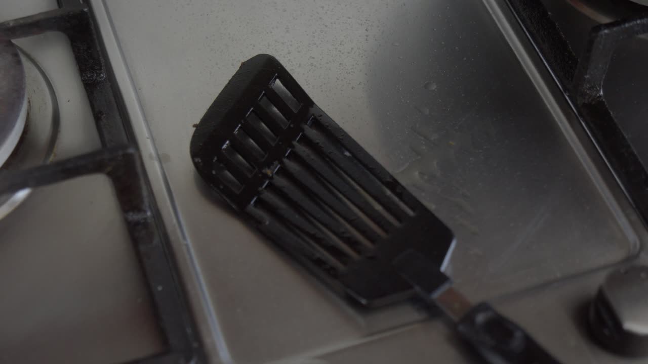 Used black cooking spatula on kitchen counter top