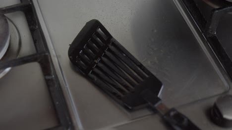 used black cooking spatula on kitchen counter top