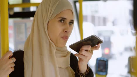 woman in hijab talking on mobile phone 4k