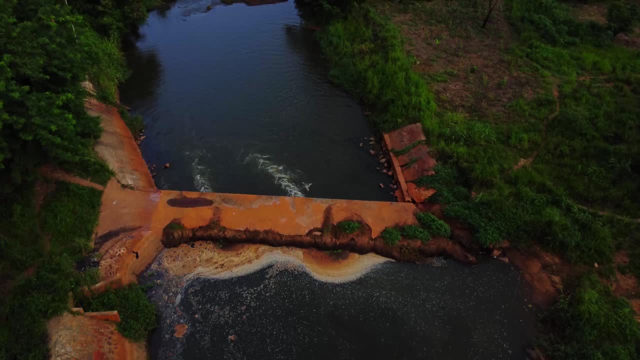 Drone flying over the peaceful Eleyele river in Ibadan, Nigeria.