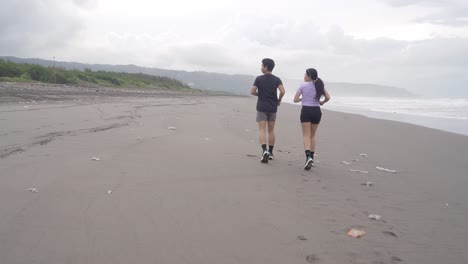 couple running on a beach