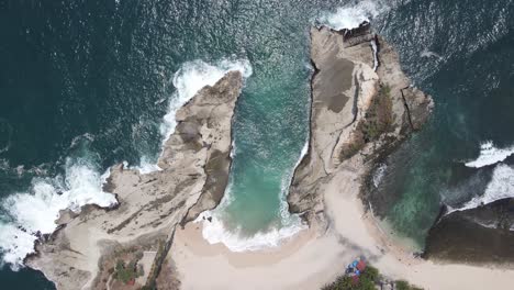 aerial view or seen from above of the beautiful klayar beach with the charm of white sand and coral in pacitan, indonesia