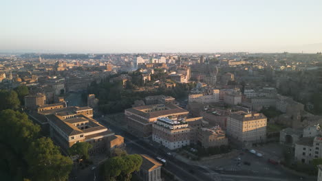 Panoramic-aerial-dolly-rises-above-streets-of-Orange-Garden-neighborhood-at-sunset-Italy