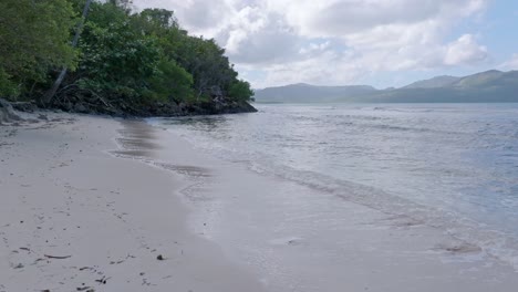 Tranquil-Scenery-At-La-Playita-Beach-In-Las-Galeras,-Dominican-Republic---Drone-Forward