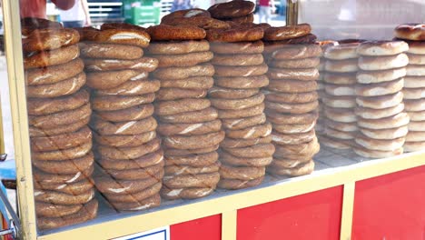 stacks of turkish bagels for sale at a street vendor