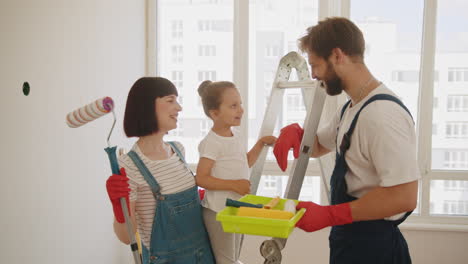 happy family painting their home