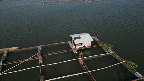 floating fish farm with workers