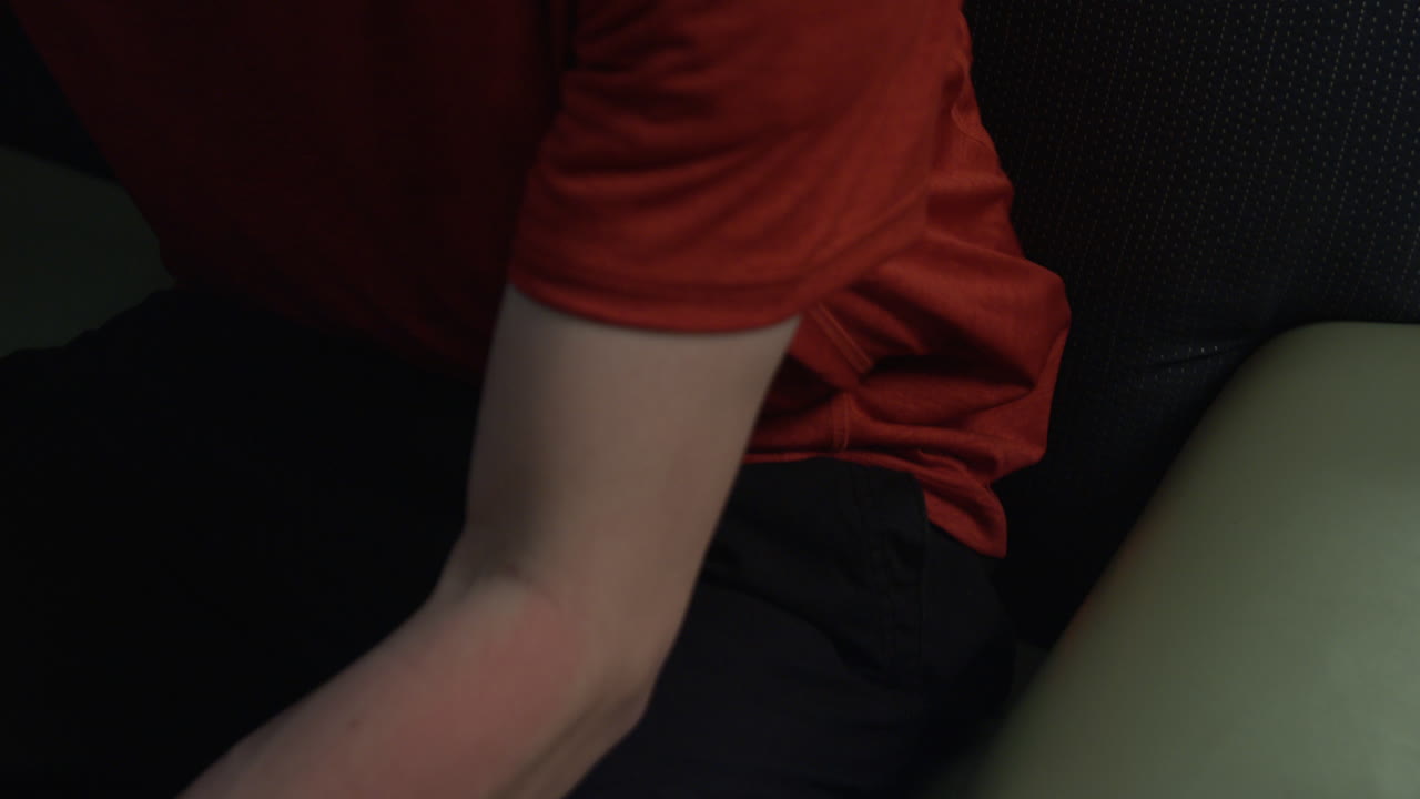 Person pulling an object from a pocket