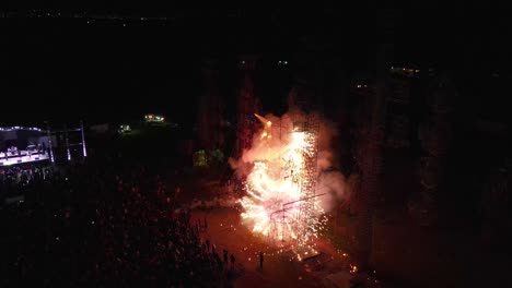 aerial view of people gathered in the park, enjoying and watching an amazing fireworks show