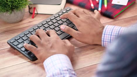 person typing on a keyboard