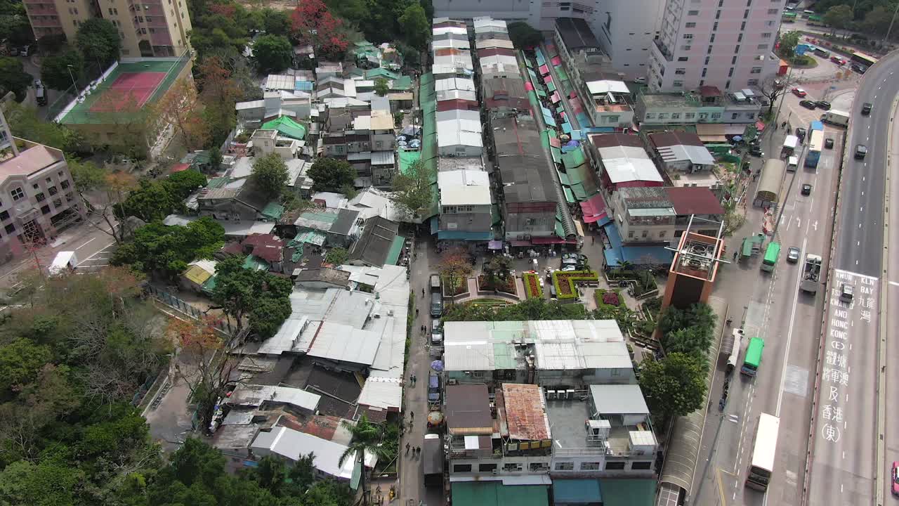 Aerial view of Ngau Chi Wan wet market rooftops, downtown Hong Kong with fresh Meat and Fish stalls.