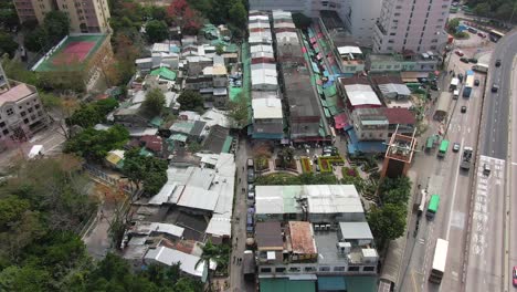 aerial view of ngau chi wan wet market rooftops, downtown hong kong with fresh meat and fish stalls.