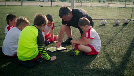 soccer coach training young players