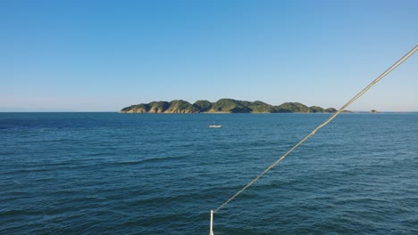 front of ship point of view in ocean headed toward island in slow motion 4k