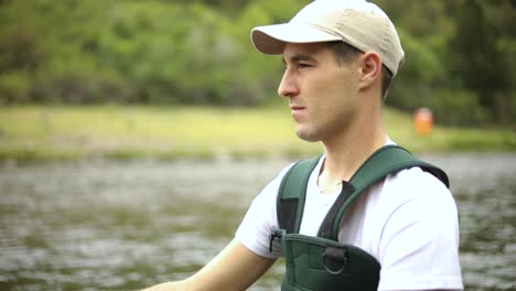 slow motion shot of a caucasian man casting his hook while fly fishing-2