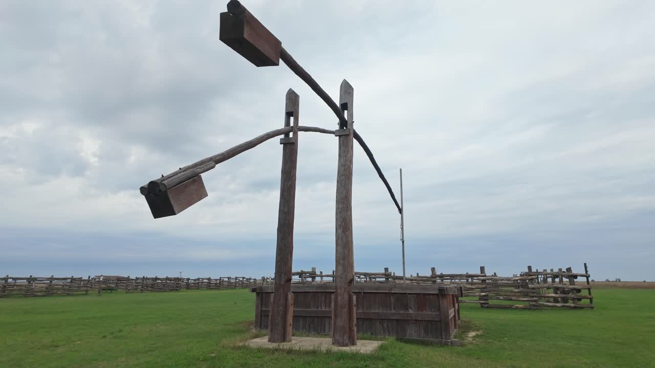 Close-up of a traditional Hungarian double-armed wooden heron well at Hortobágy, Great Plain
