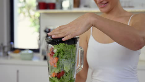 woman making a smoothie