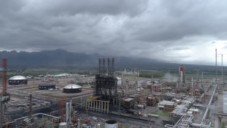 vaca muerta oil field in argentina under cloudy sky, industrial scene