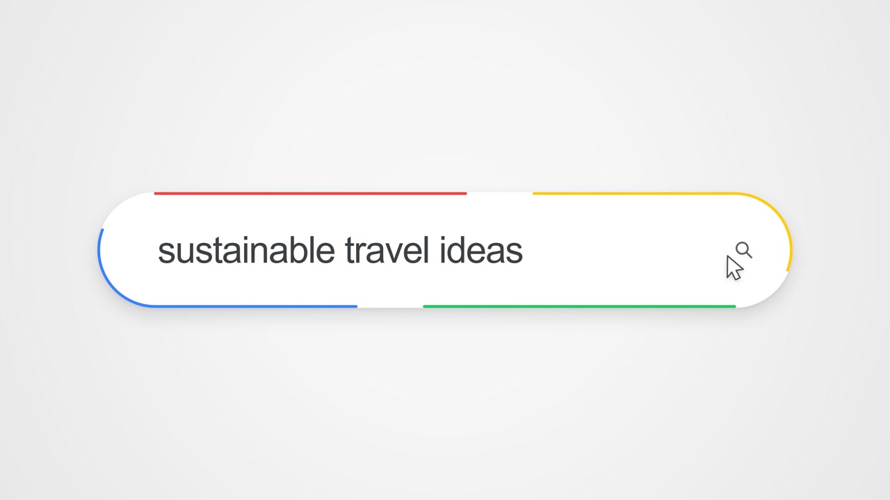 Close-up view of typing "sustainable travel ideas" into an online search bar with a cursor clicking the search icon, illustrating internet search and eco-friendly travel research