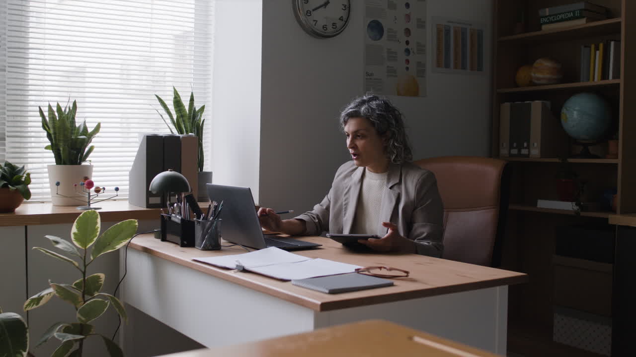Teacher giving an online presentation in a classroom setting