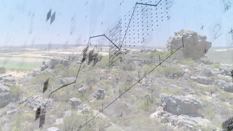 geometric patterns and lines animation over rocky landscape with vegetation