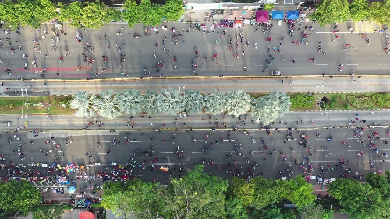 Busy Street Scene with Large Crowds