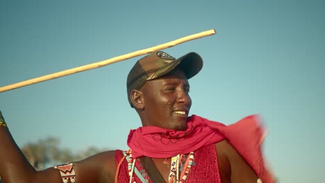 aborigine african maasai warrior man is trying to throw stick spear in kenya