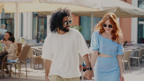 couple walking in a city cafe