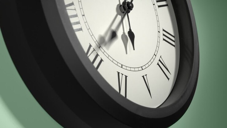 Latin Clock Face on Light Green Wall in Time Lapse