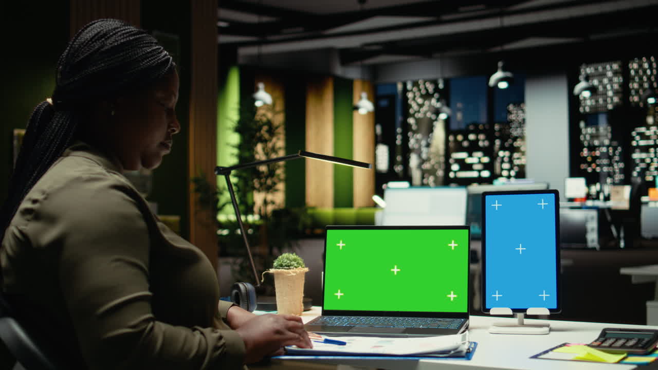 Green screen and vertical blue screen on tablet and laptop with black CEO