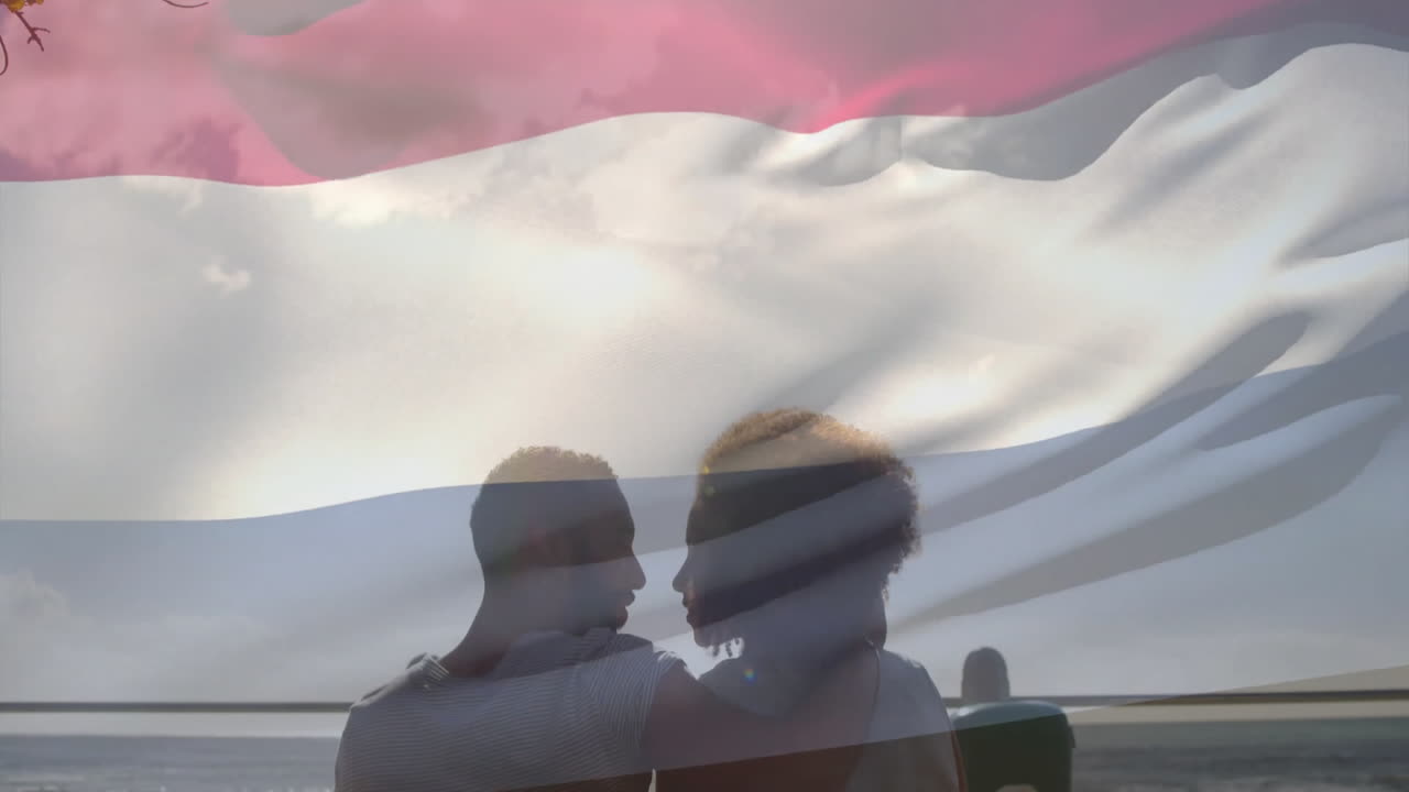 네덜란드 발의 애니메이션 두 인종의 커플이 포옹하고 키스하고 있습니다.