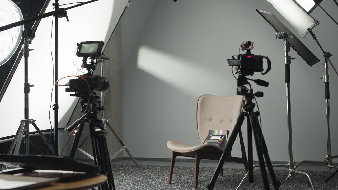 Set of film cameras and lights in a studio. Lights off