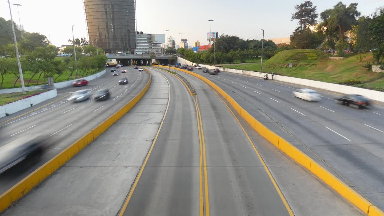 Timelapse of a freeway called "Vía Expresa Luis Fernán Bedoya Reyes" cars blur as they pass by in rapid motion. Located in Lima, Peru. Recorded in 4k quality