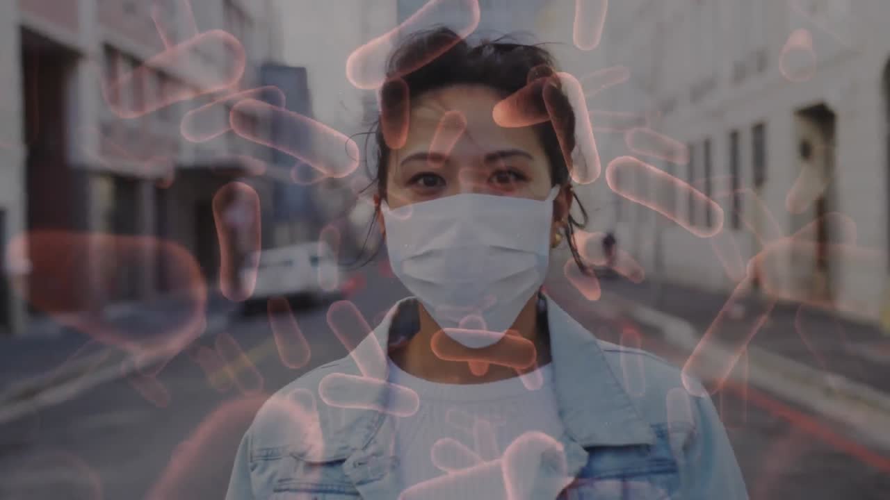 анимация клеток covid-19, движущихся над женщиной в маске