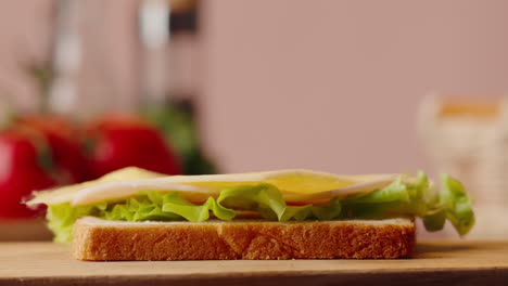 making a cheese and ham sandwich