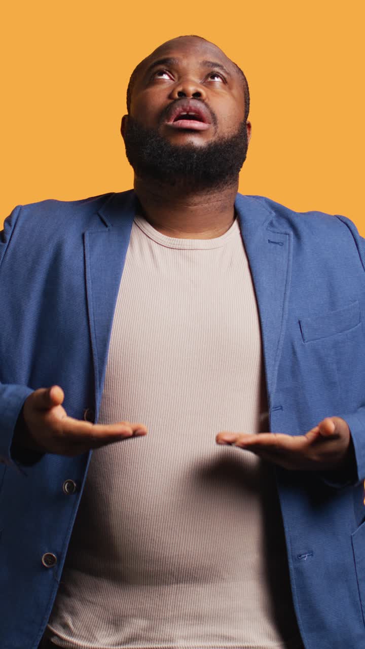 African American Man Meditating with Eyes Closed in Studio