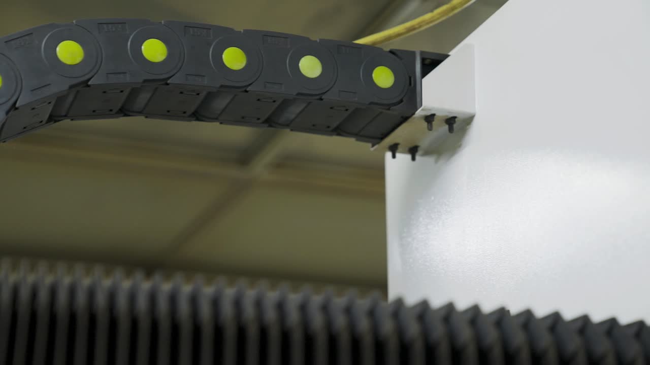 Bending cable cover on moving CNC laser machine, flexible protection of cables