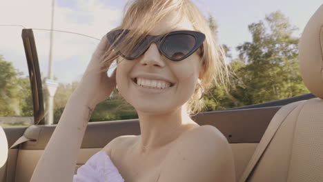 woman enjoying a drive in a convertible