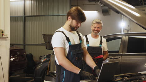 car repair by mechanics in garage