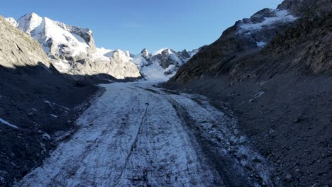 Aerial-flyover-over-Forno-glacier-in-Engadin,-Switzerland-shortly-before-sunset